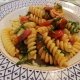Fusilli con speck, rughetta e pomodorini