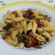 Pennette con funghi carciofi pomodorini e guanciale