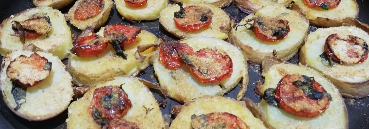 Patate gratinate al forno con pomodorini