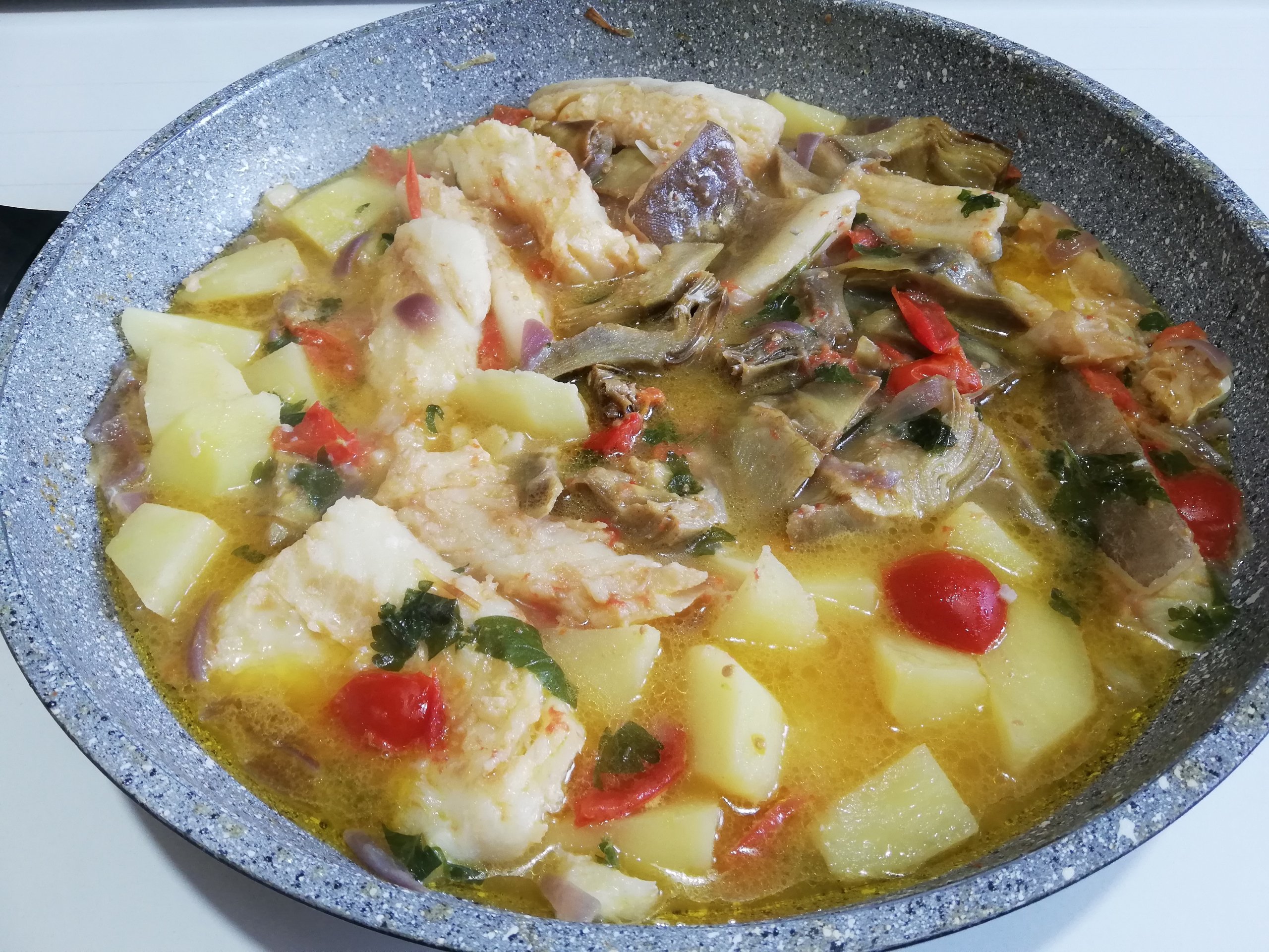 Filetti di baccalà con patate e carciofi