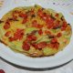 Fiori di zucca in pastella al forno con pomodorini e alici